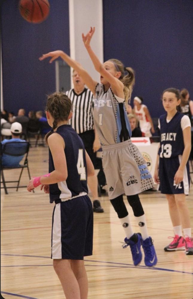 A younger Maya Makalusky shooting a jumper back during her first AAU travel basketball game in Colorado.
